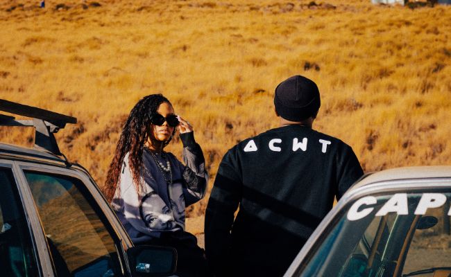 Streetwear models wearing graphic sweater styles outdoors, showcasing relaxed urban fashion.