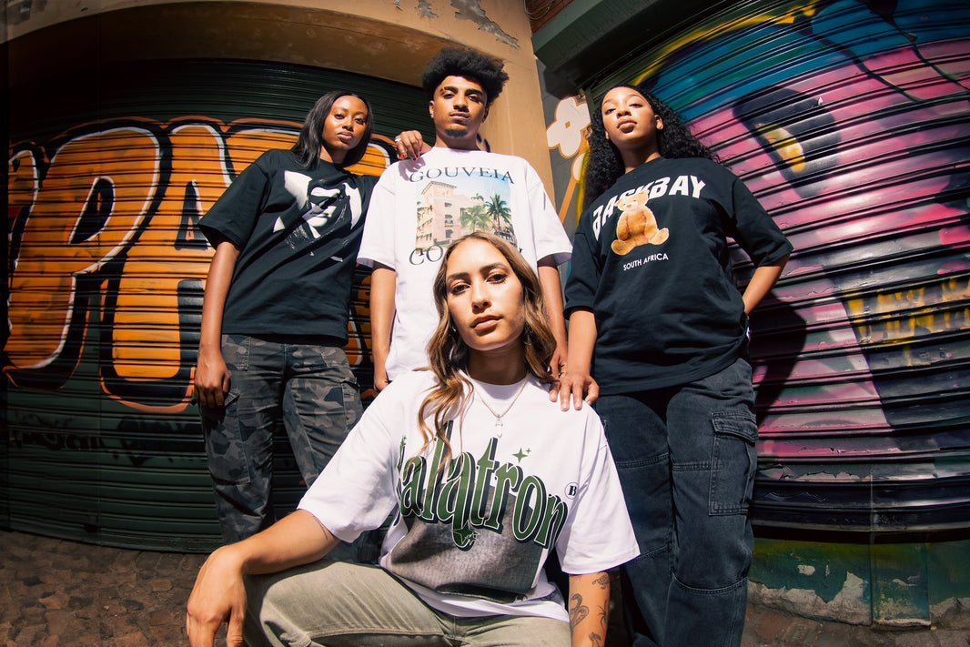 Group styled in graphic and logo tees highlighting branded t-shirts in South Africa and urban streetwear fashion.