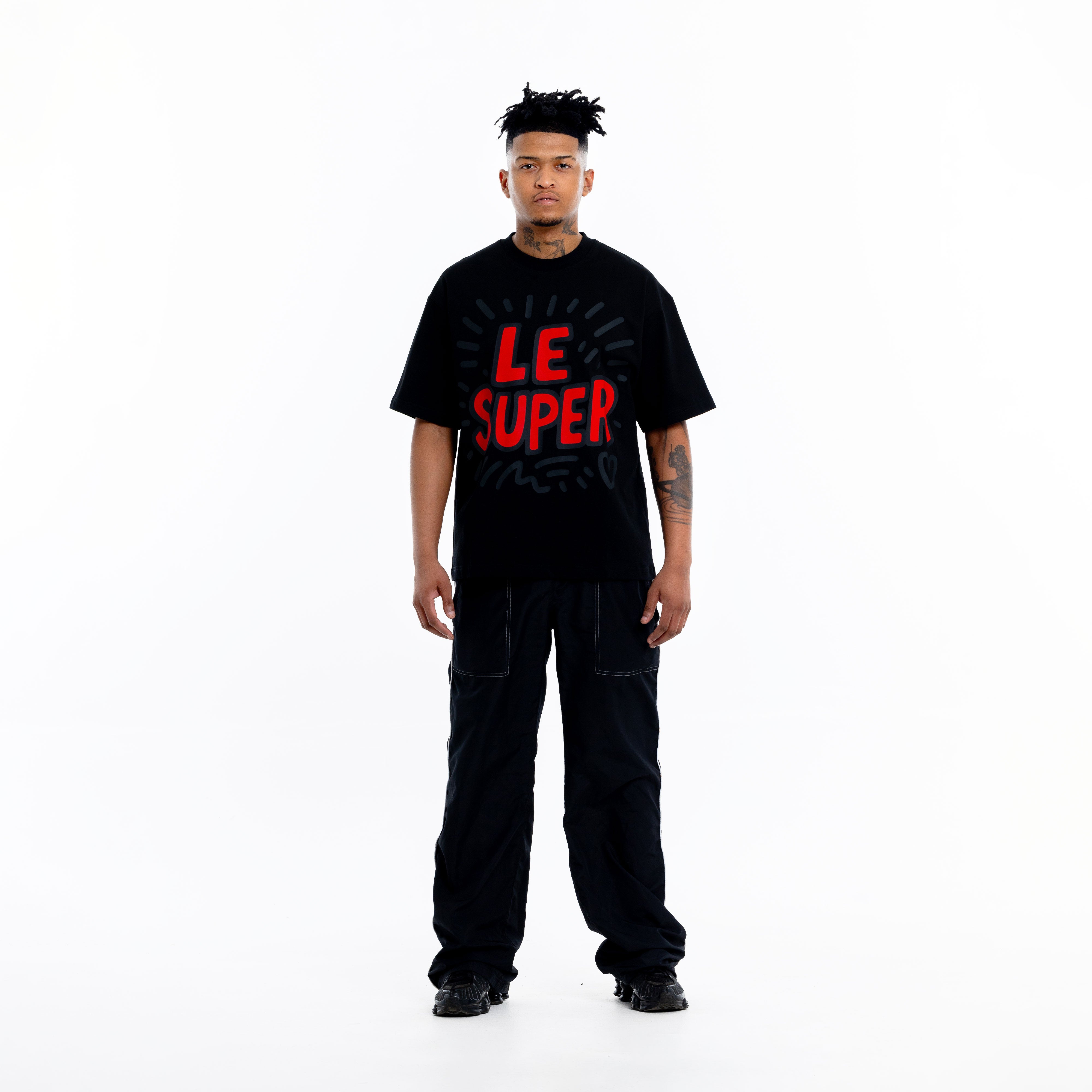Full outfit with black graphic t-shirt styled in a modern streetwear look
