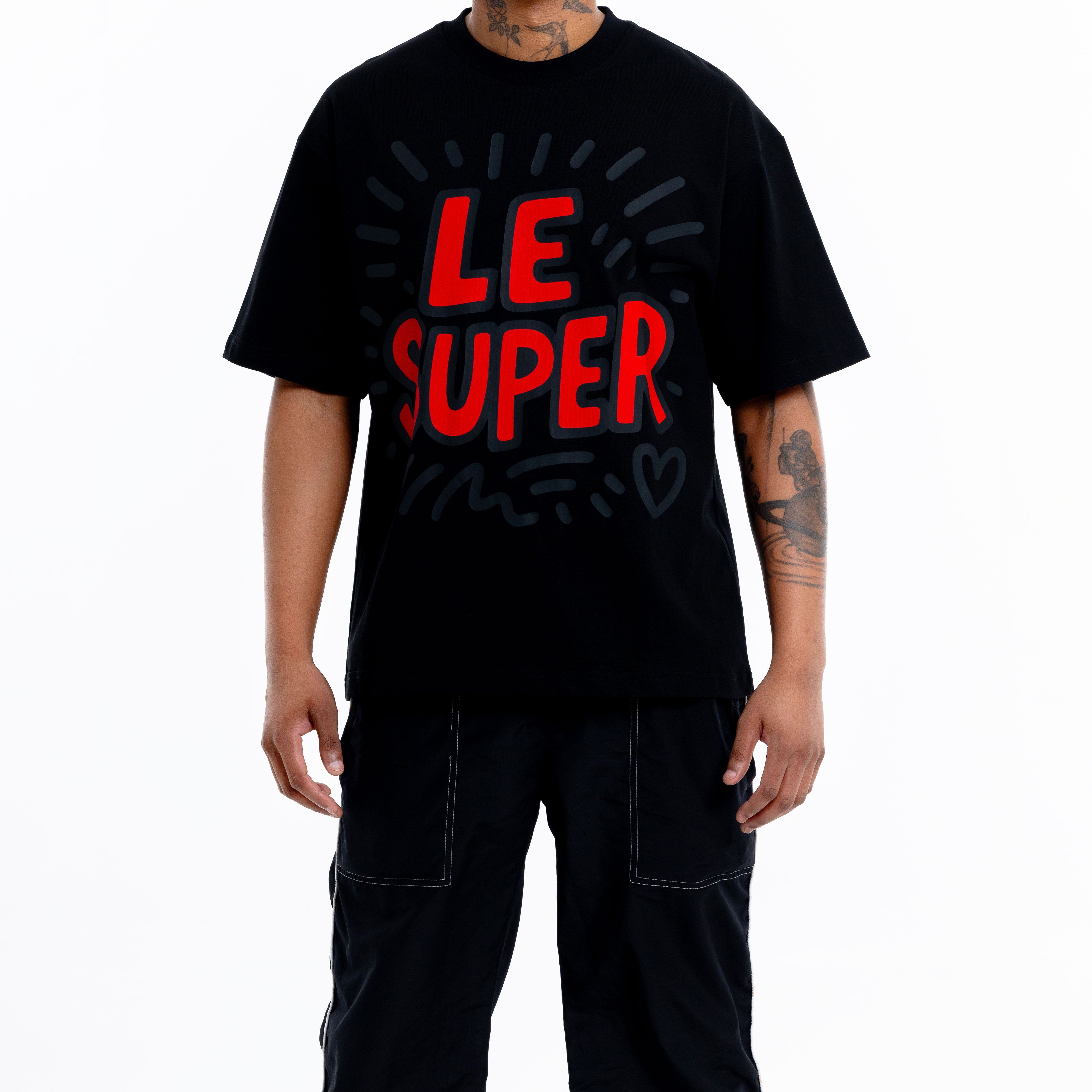 Model wearing black graphic t-shirt with bold print, round neck fit