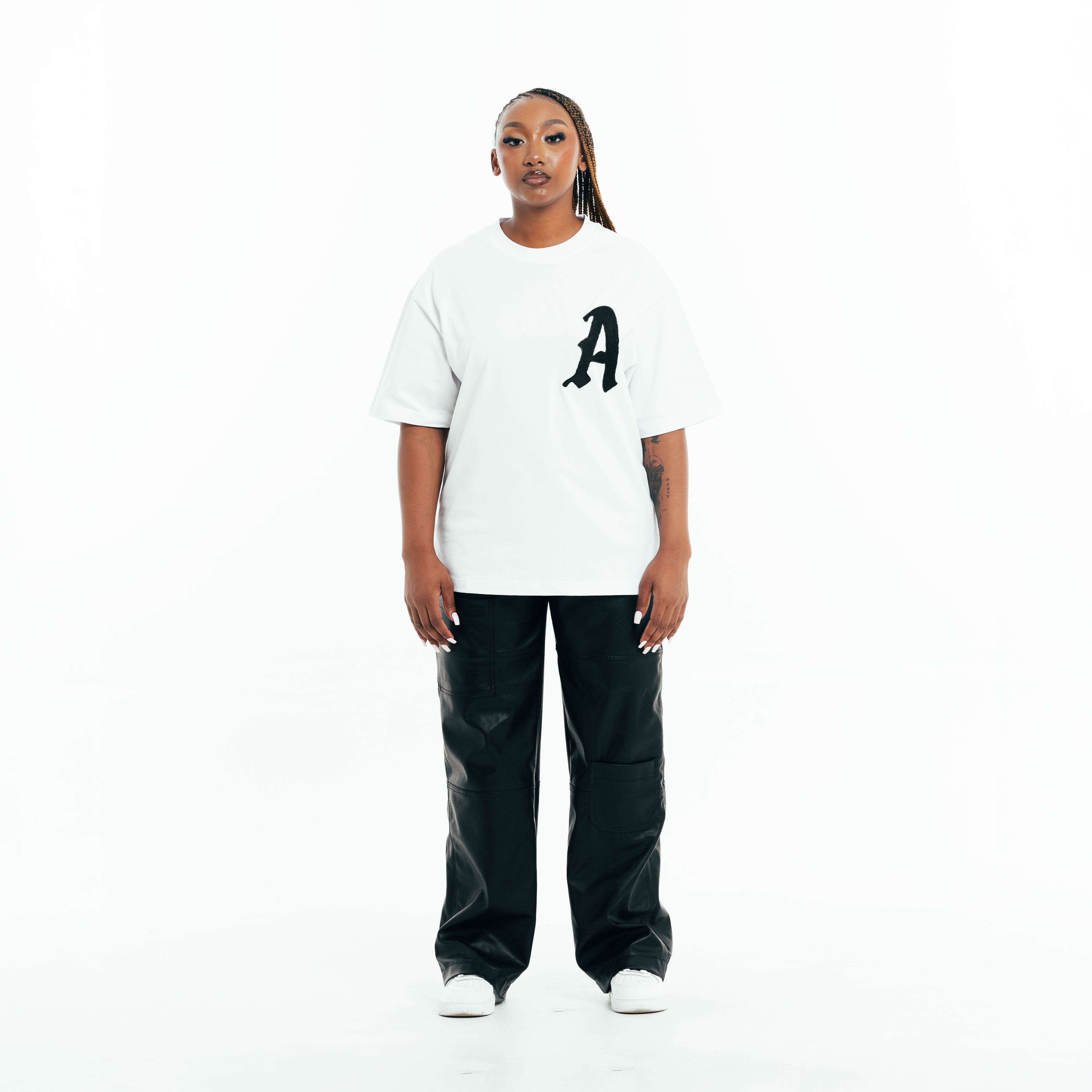 Model wearing white cotton t-shirt with front print, relaxed fit