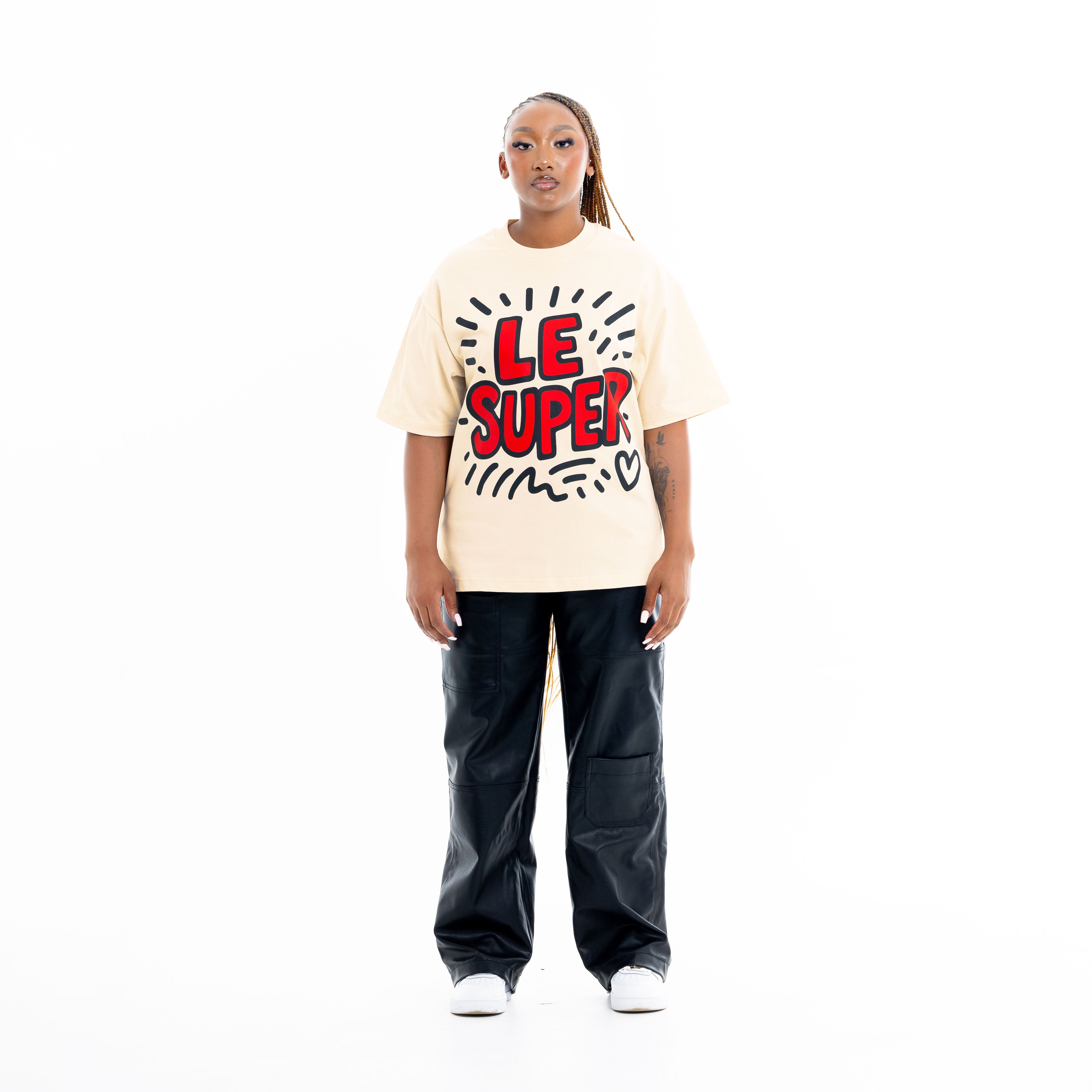 Model wearing cream graphic t-shirt with large front graphic design